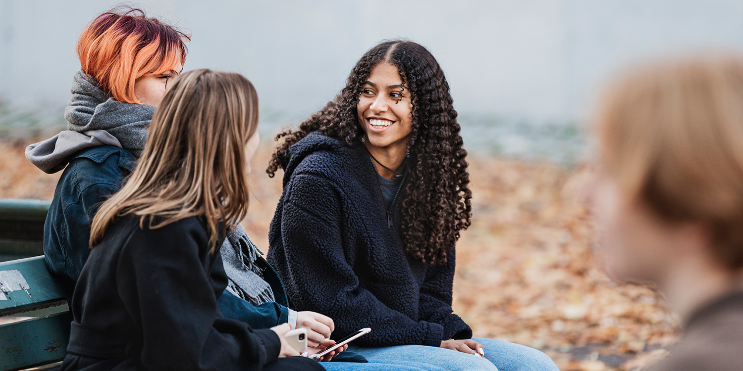 Teenagers hanging around outside.