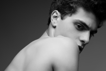 8537706-beautiful-handsome-muscular-male-model-posing-over-gray-background-healthy-skin-vogue-style-close-up-copy-space-black-and-white-monochrome-fashion-studio-portrait.jpg