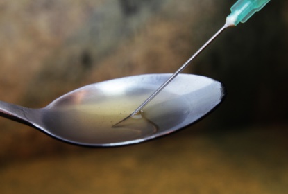 Drug and syringe