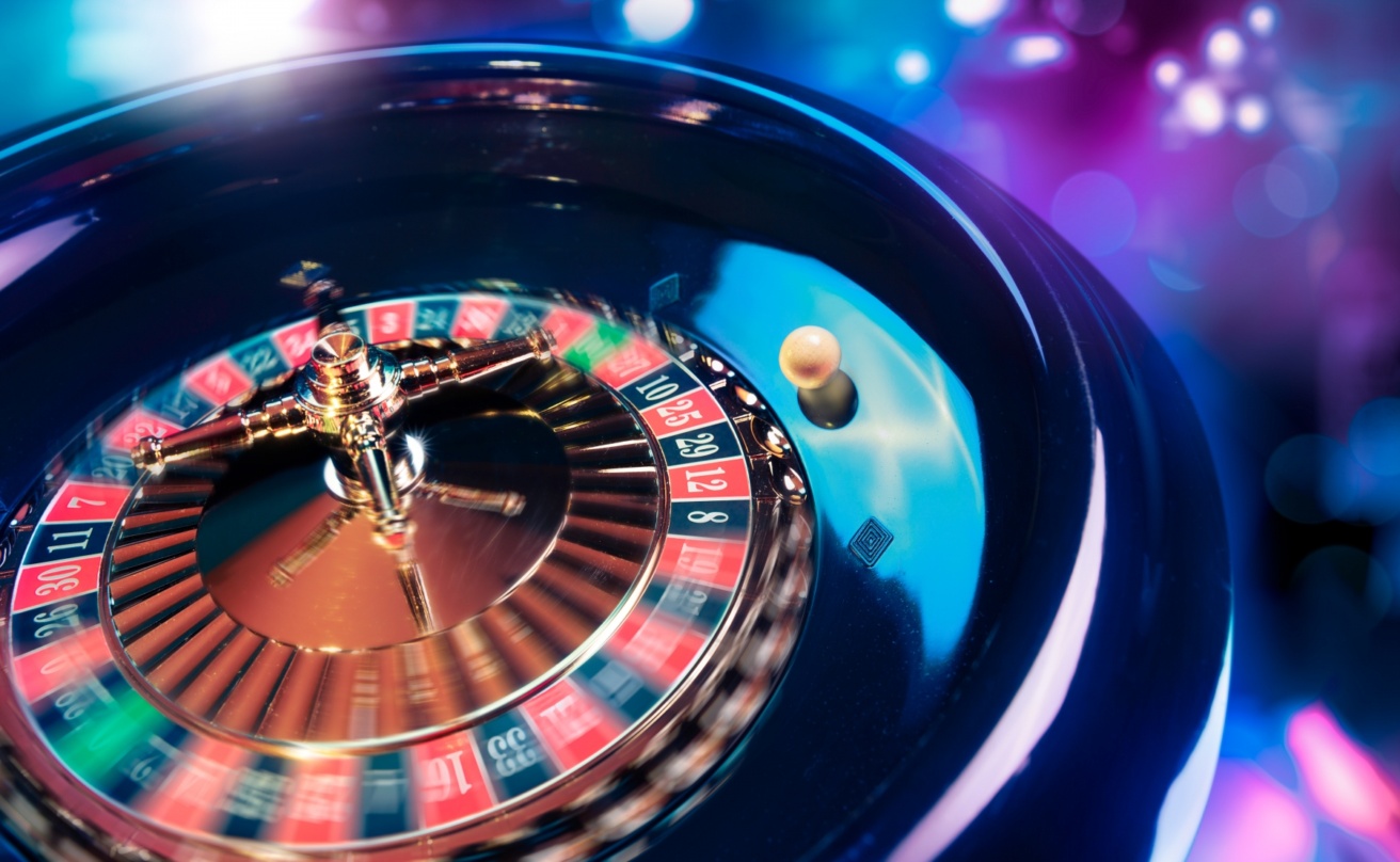 12823558-roulette-wheel-in-motion-with-a-bright-and-colorful-background