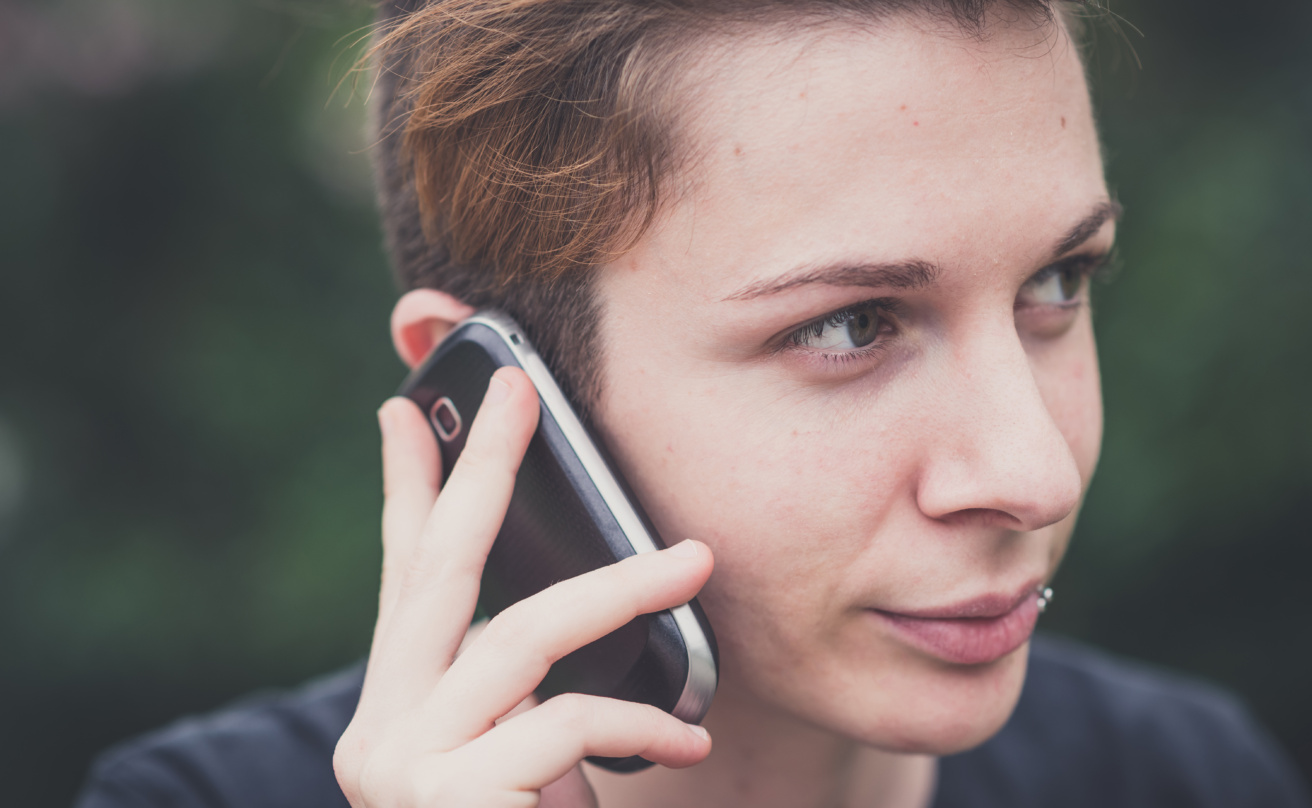 8794459-young-stylish-hair-style-woman-using-smart-phone.jpg