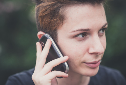 8794459-young-stylish-hair-style-woman-using-smart-phone.jpg