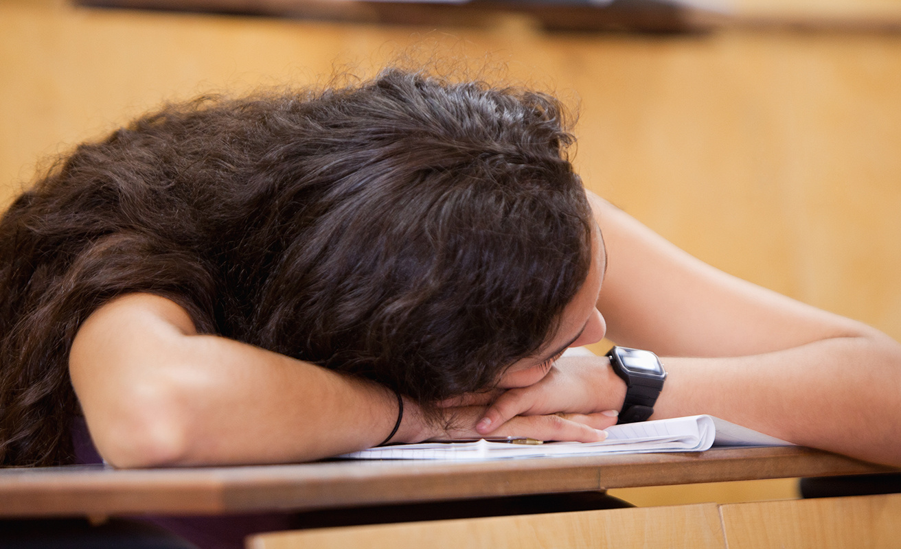 Student sleeping on her desk