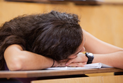 Student sleeping on her desk