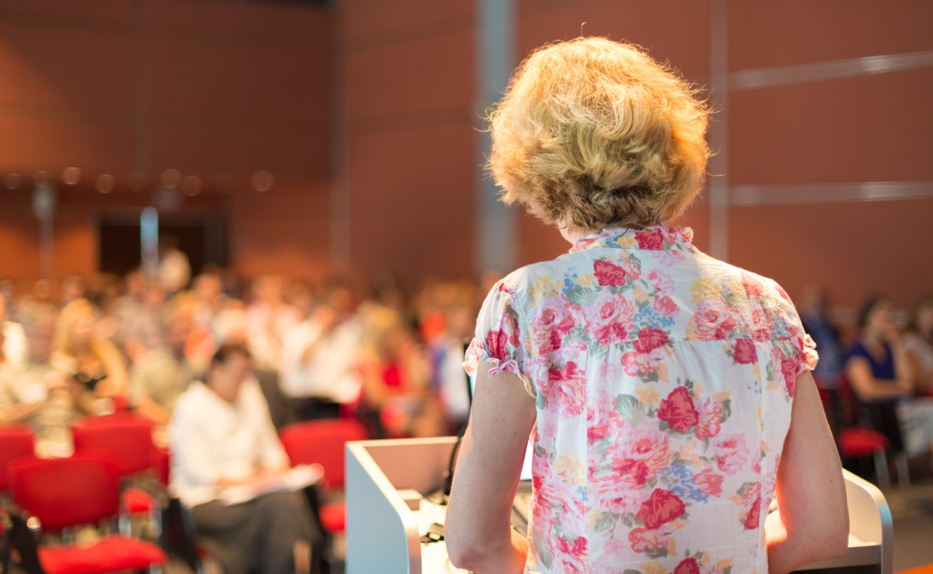 Female academic professor lecturing.