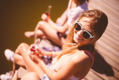 Girl sitting with friends on a summer holiday