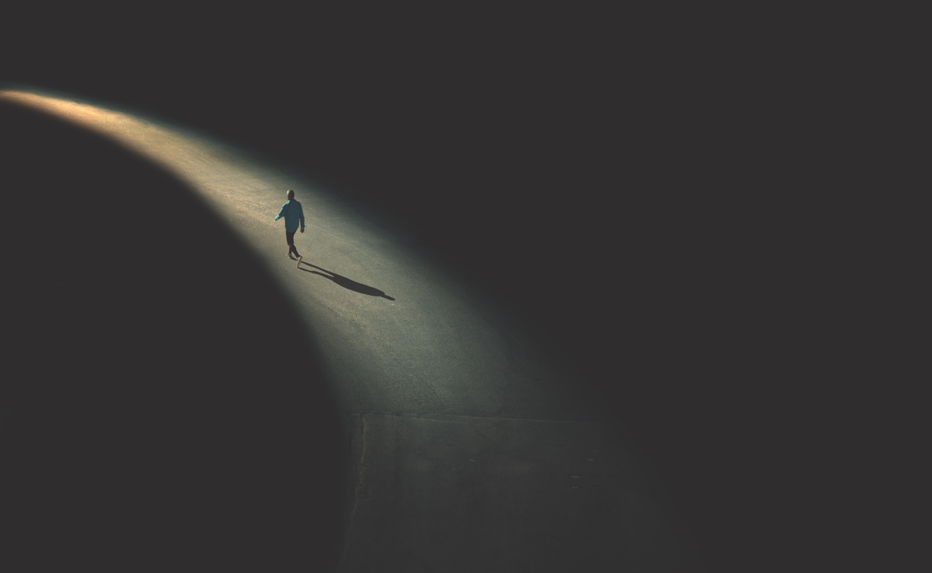man walking in the night