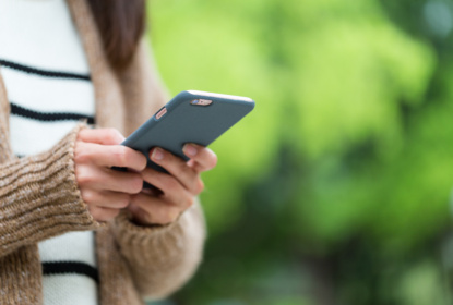 Woman play game on cellphone