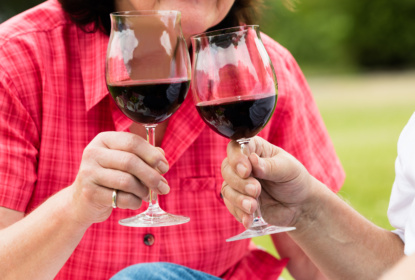 Couple Toasting Glass Of Wine