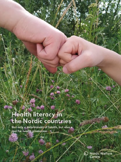 The hand of a child and the hand of an adult fist bumping among flowers.