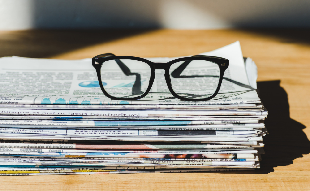 31398855-different-print-newspapers-in-pile-on-wooden-table-with