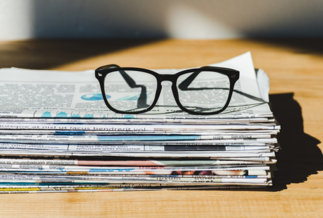 31398855-different-print-newspapers-in-pile-on-wooden-table-with