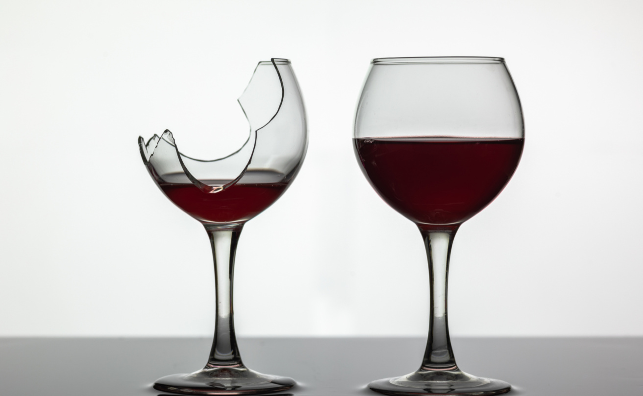 31744025-broken-and-not-broken-wine-glass-with-red-wine-on-white