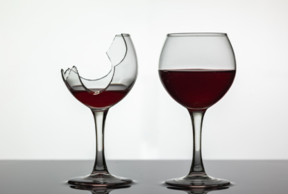 31744025-broken-and-not-broken-wine-glass-with-red-wine-on-white