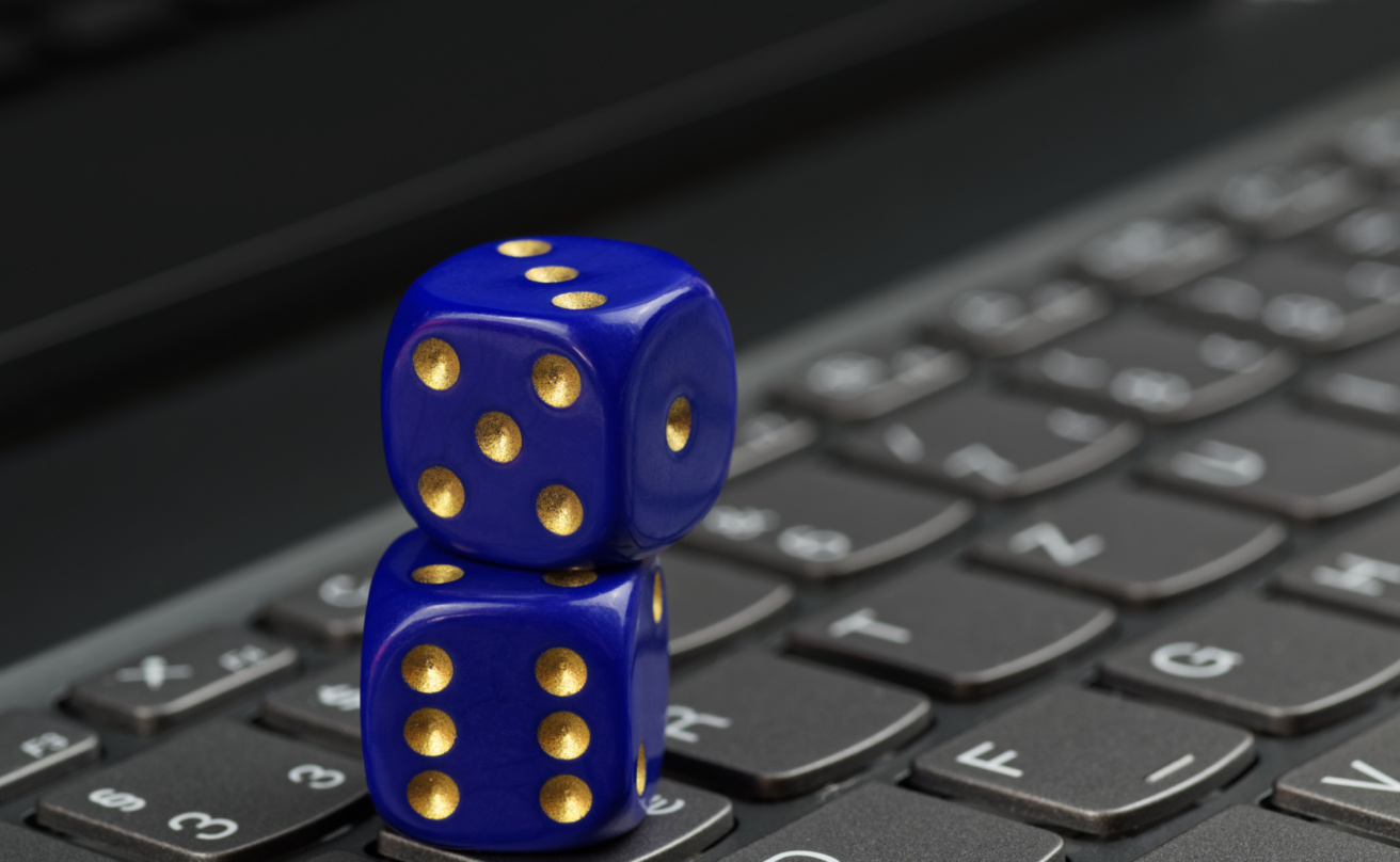 35708003-two-blue-dices-on-black-computer-keyboard