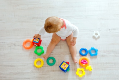 31575308-adorable-baby-girl-playing-with-educational-toys-in