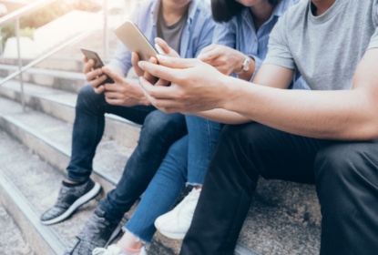 32924108-group-of-young-teen-using-mobile-phones