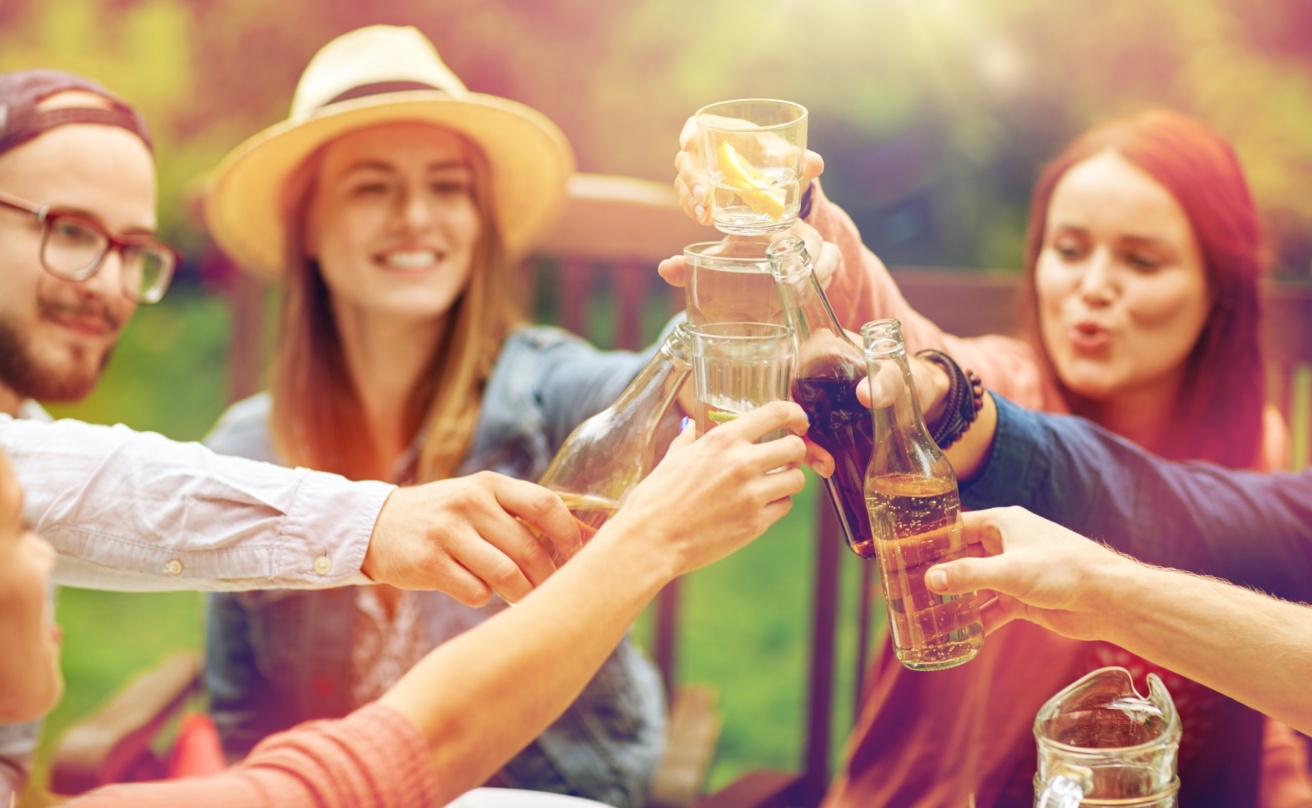 22549514-happy-friends-with-drinks-at-summer-garden-party