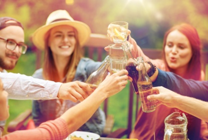 22549514-happy-friends-with-drinks-at-summer-garden-party