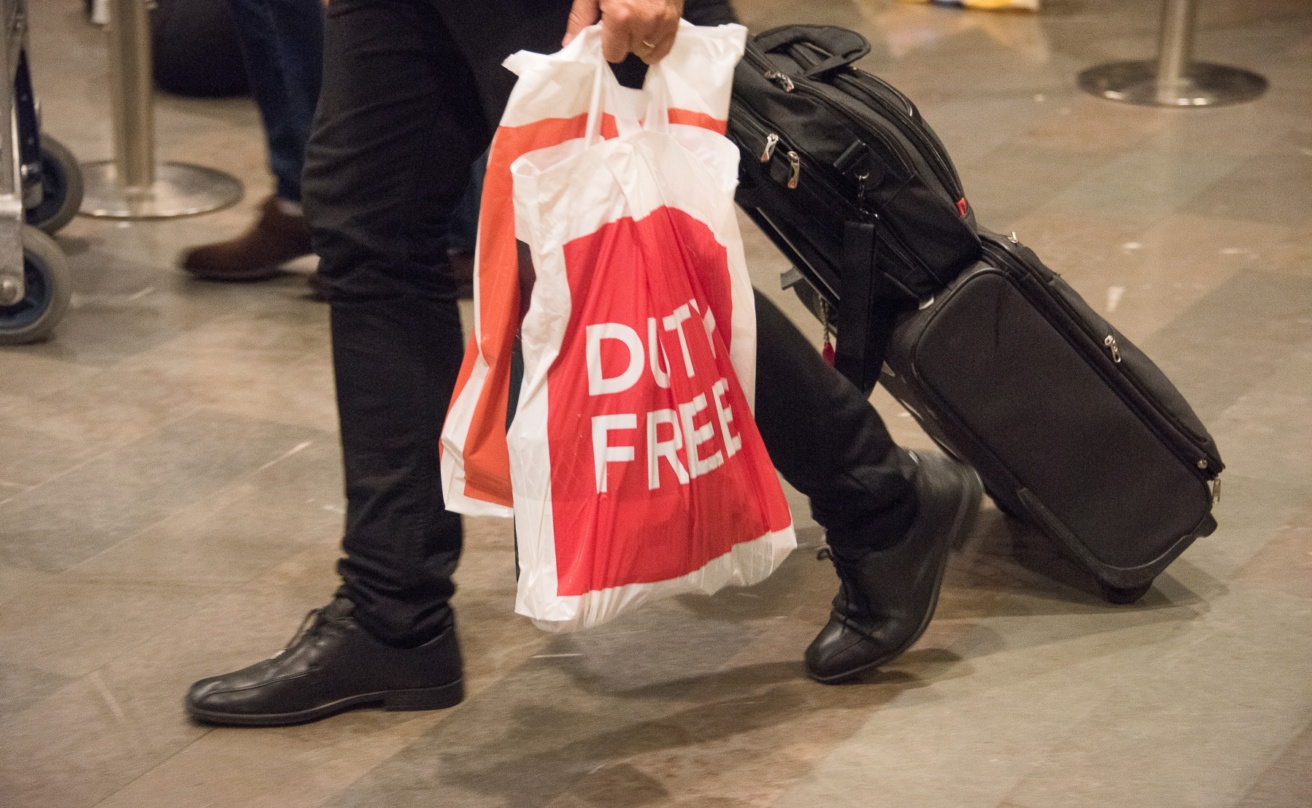 Man carrying duty free bags