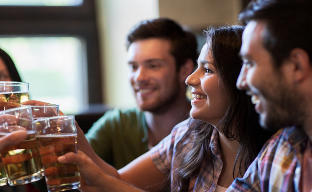 17605833-happy-friends-drinking-beer-at-bar-or-pub