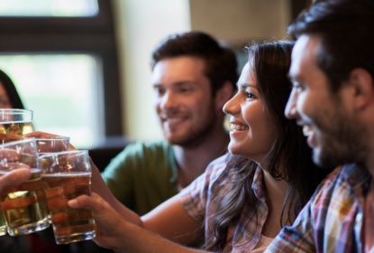 17605833-happy-friends-drinking-beer-at-bar-or-pub