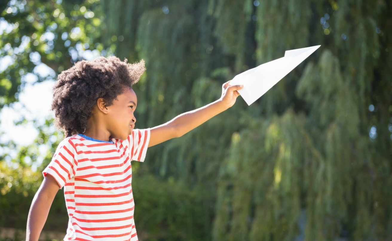 15645718-boy-is-playing-with-a-paper-plane