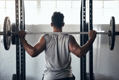 57960304-fitness-exercise-in-gym-man-weightlifting-barbell-and
