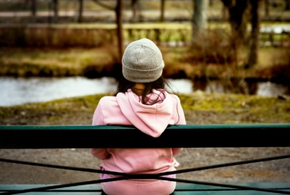 61810096-woman-sitting-alone-on-park-bench