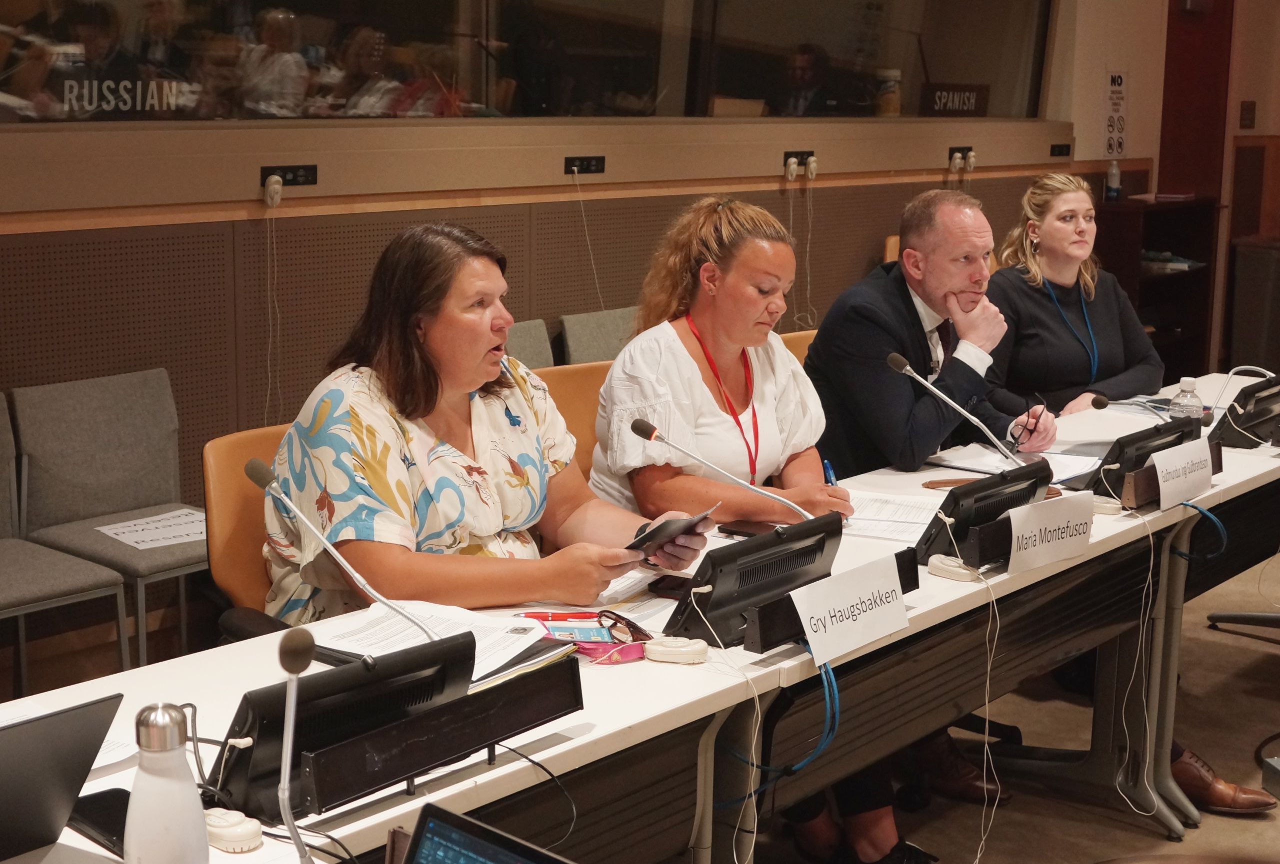 Small group of people sitting at a conference table