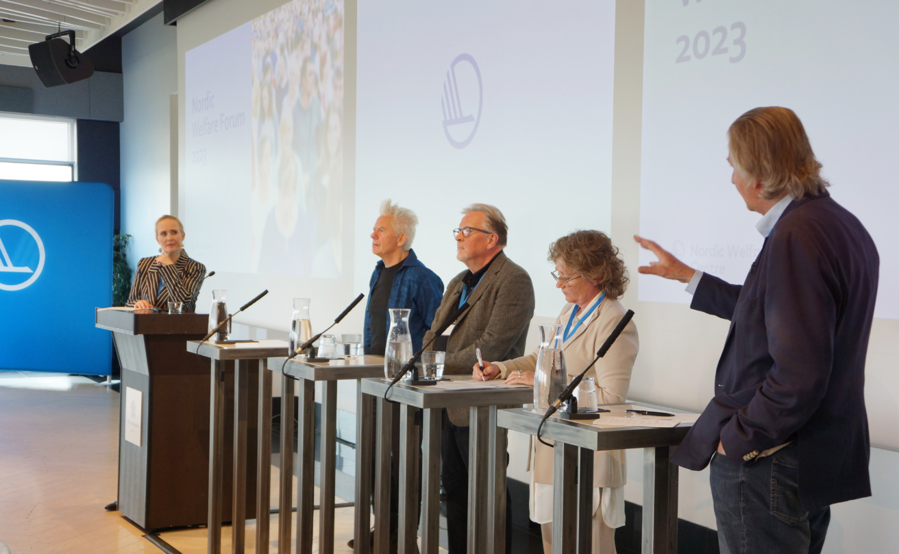 Panel discussion with four participants and a moderator.