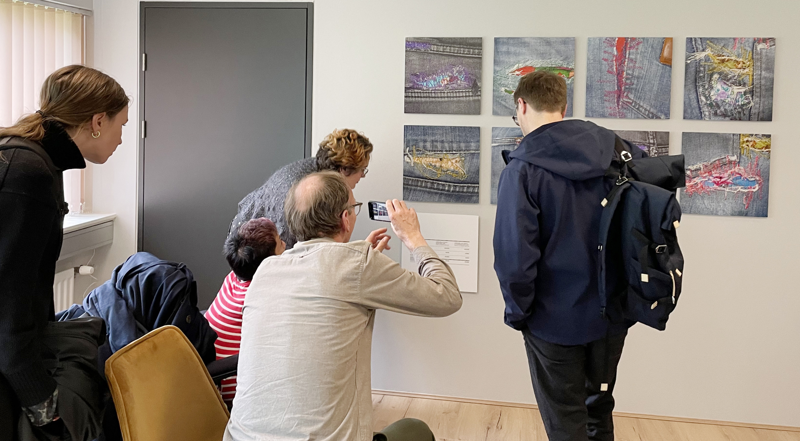 People looking at artwork