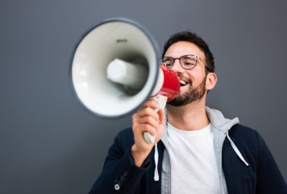43202055-man-hand-holding-megaphone
