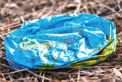Plastic deflated earth thrown in nature