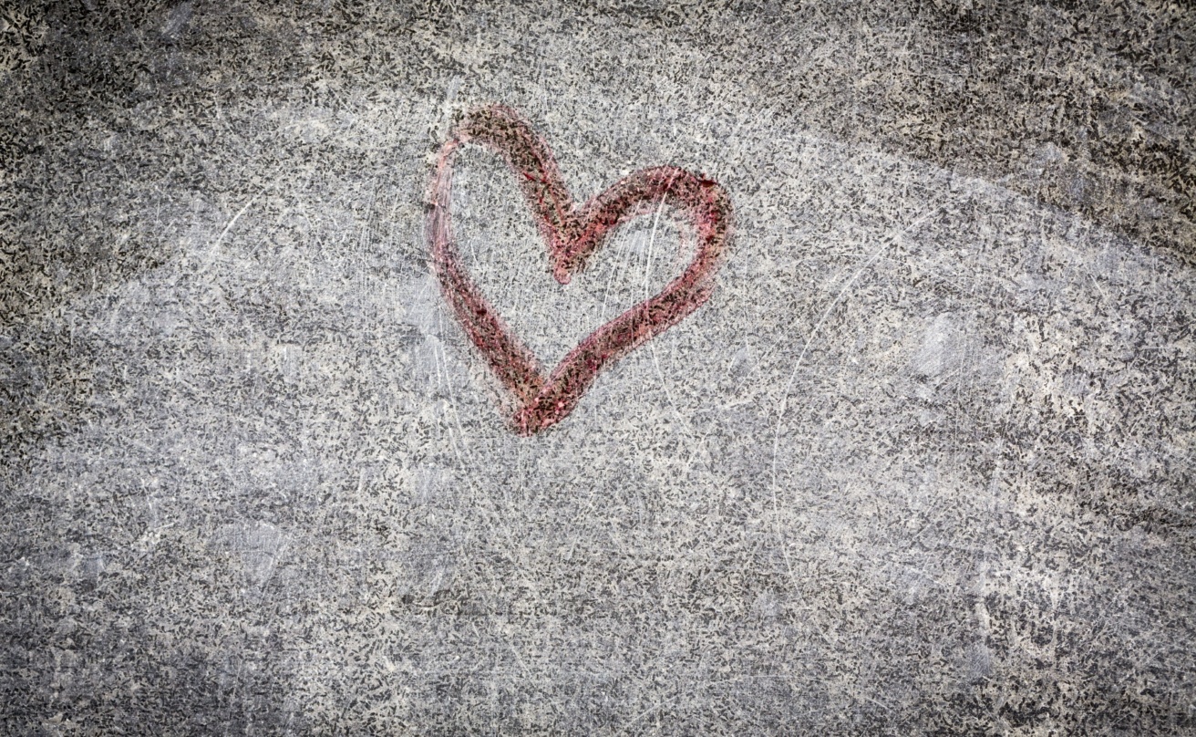 Red heart painting on a grungy wall