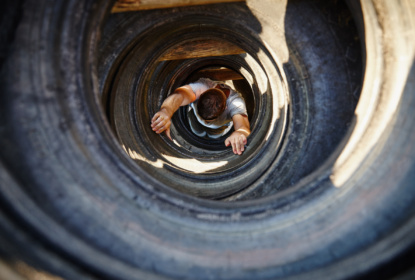 Picture from above of man climbing up a tunnel