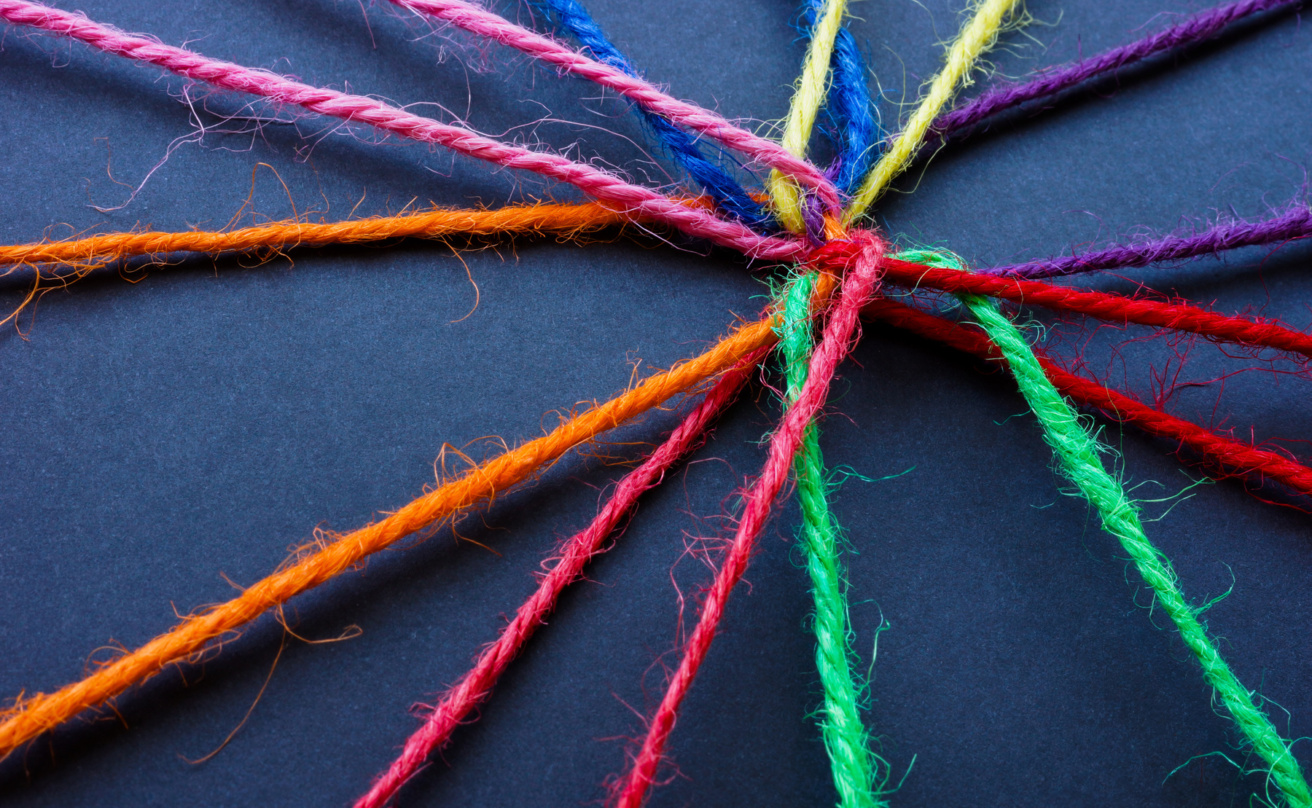 Connected colored threads as a concept of unity
