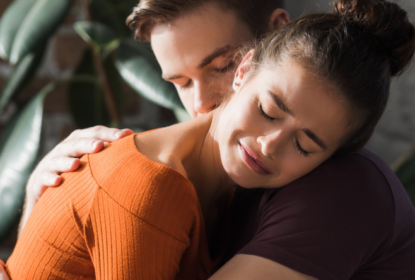 Woman crying being hugged by man showing self-regulation