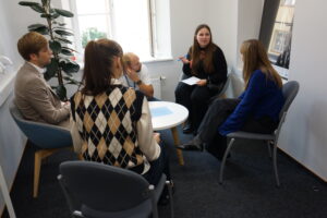 Young people discussing round a table at Nordic Baltic Youth summit