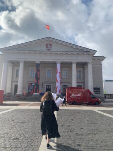 Person waking towards Vilnius Town hall during nordic baltic youth summit