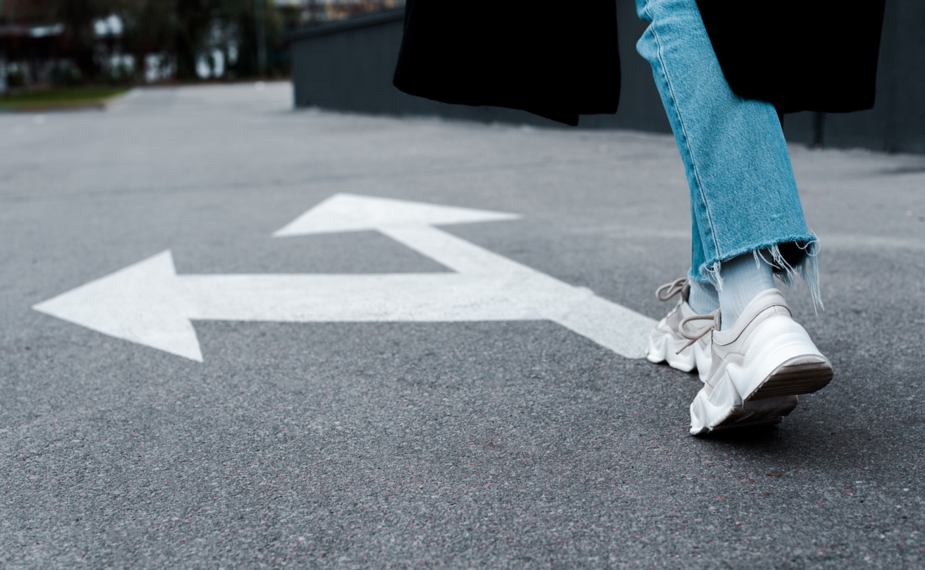 Cropped view of woman in jeans walking