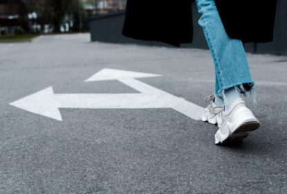 Cropped view of woman in jeans walking