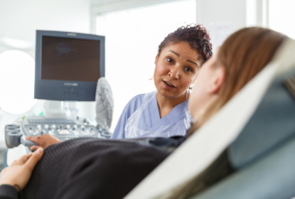pregnant patient talks to nurse