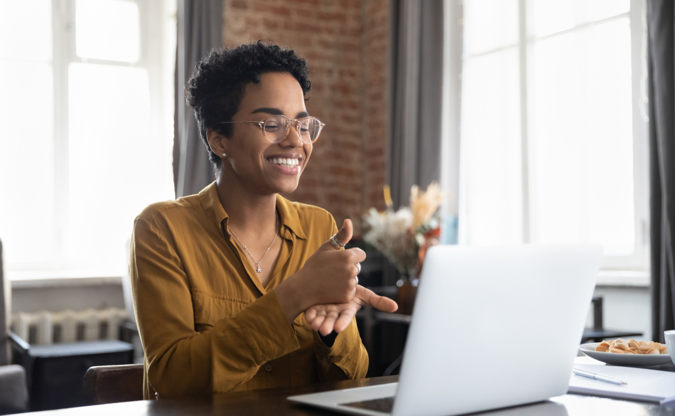 woman sitter in front of computer signing showing digital inclusion