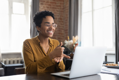 woman sitter in front of computer signing showing digital inclusion