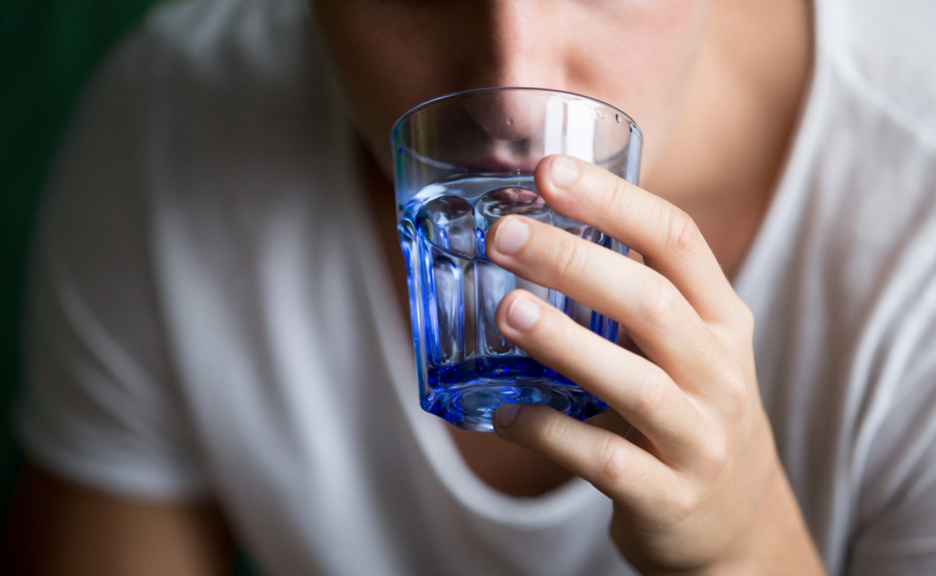 mp29120408-close-up-of-man-drinking-still-water