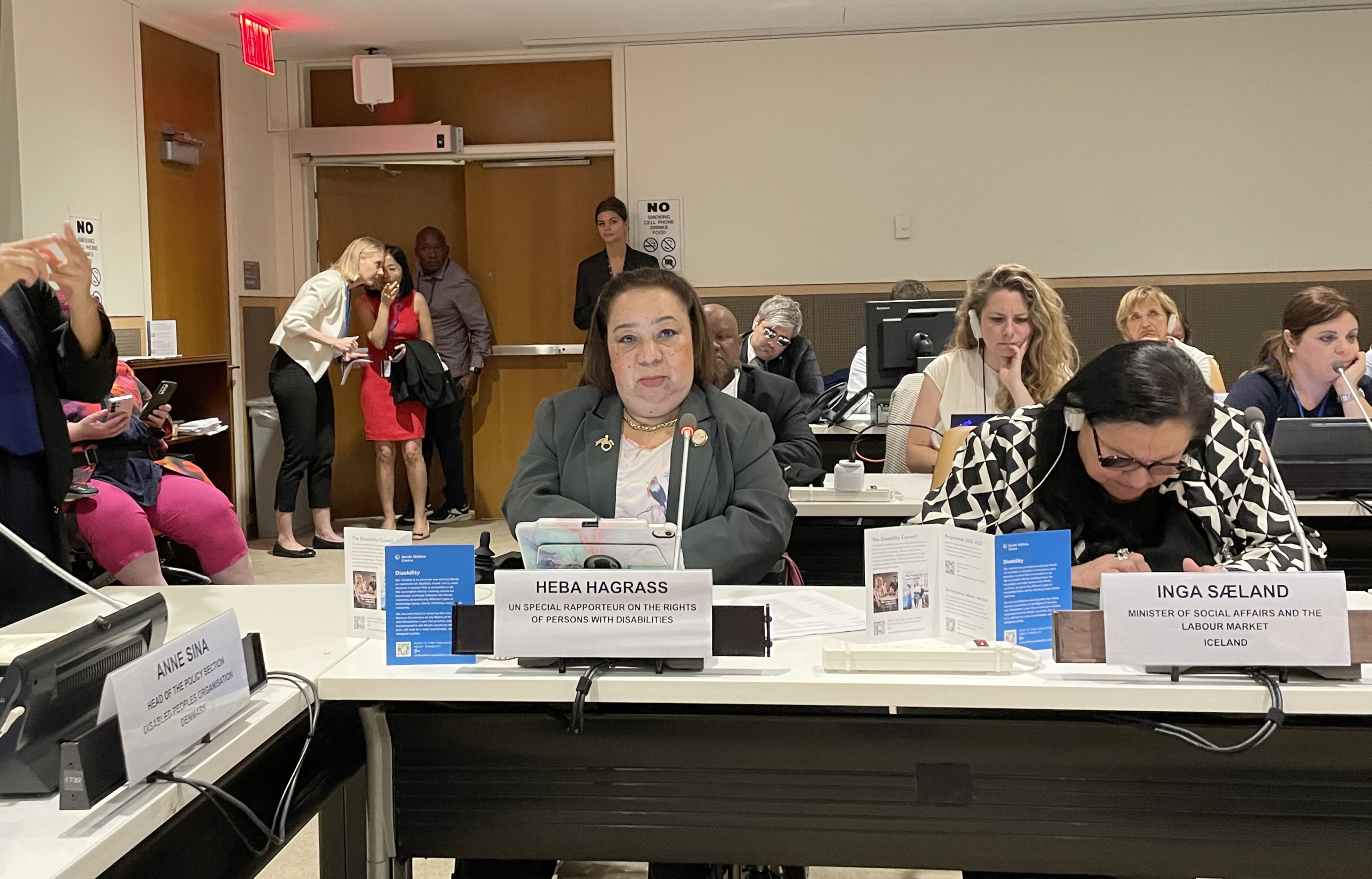 Heba Hagrass speaking in a conference room