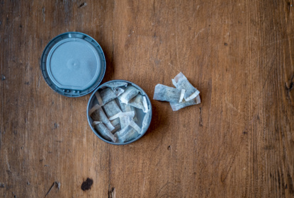 snus on wood background