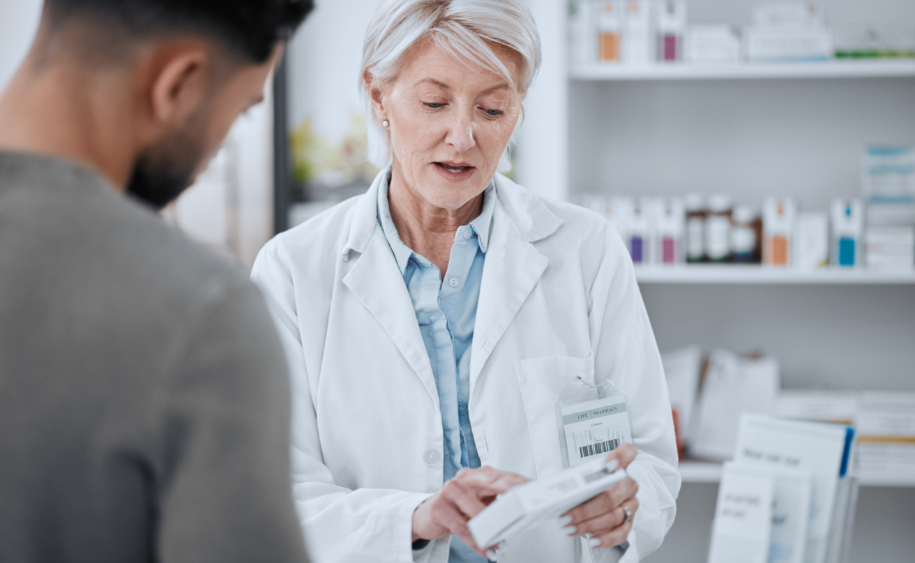 Pharmacist and customer in consultation