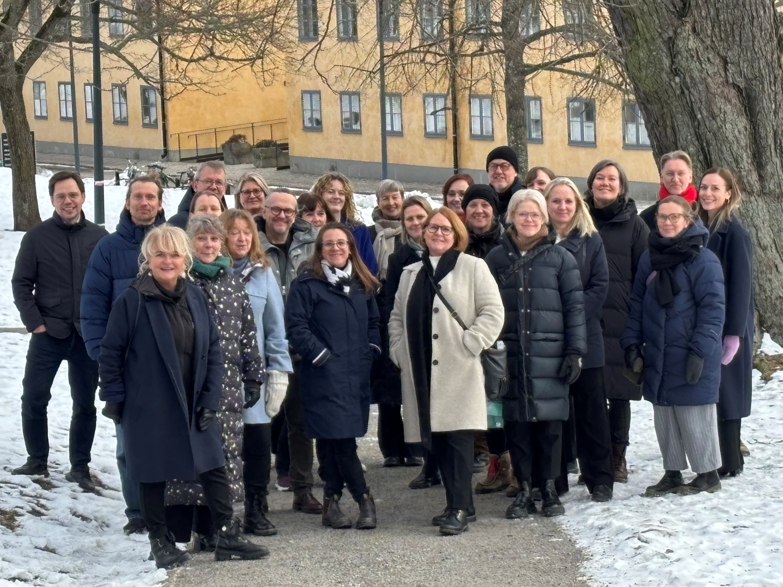 Group of particpants posing for group picture outside